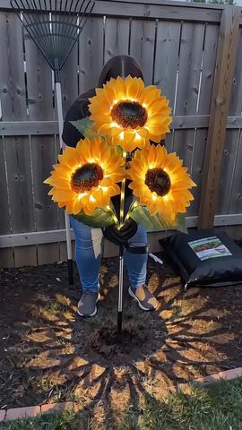 I can’t believe how much these upgrades my front porch and backyard area ❤️❤️#solarsunflowers #flowerlight #gardendecor #backyardgarden #fyp 